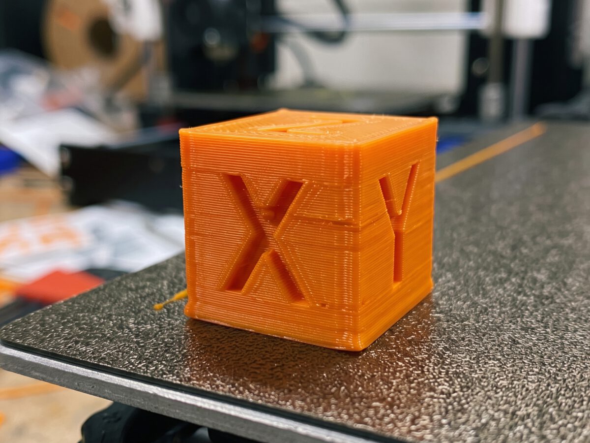 A 3D printed calibration cube marked with X, Y and Z.