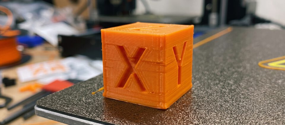 A 3D printed calibration cube marked with X, Y and Z.